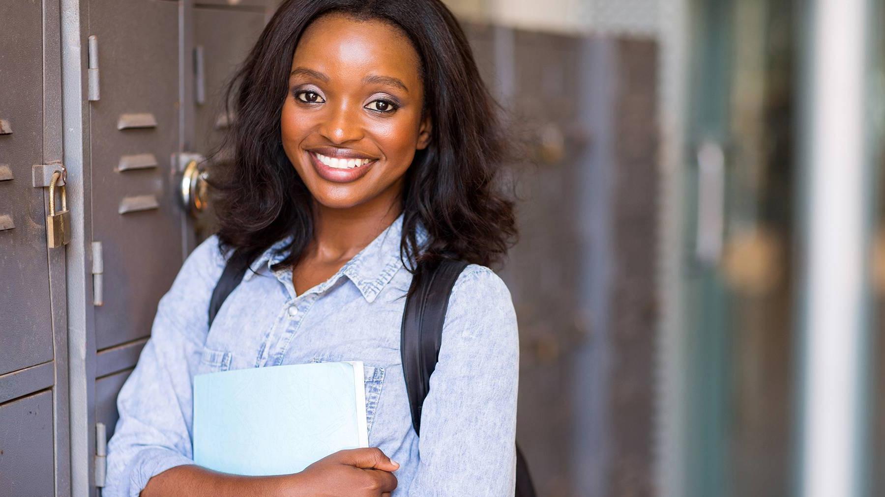 Girl smiling near lockers